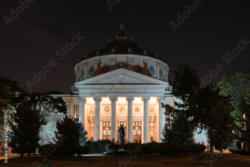 Romanian Atheneum in Bucharest. Night landscape under the full moon with this iconic landmark from Romania. Long exposure photo. photo