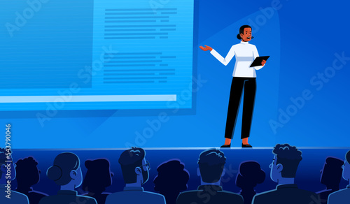 Conference or scientific seminar. Woman performing on stage in front of an audience in the hall. Business lecture, event