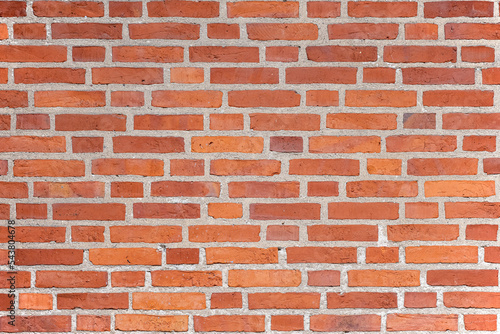 Background from a clean and regular red brick wall