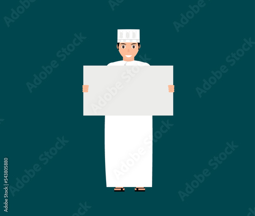 Omani boy holding blank sign