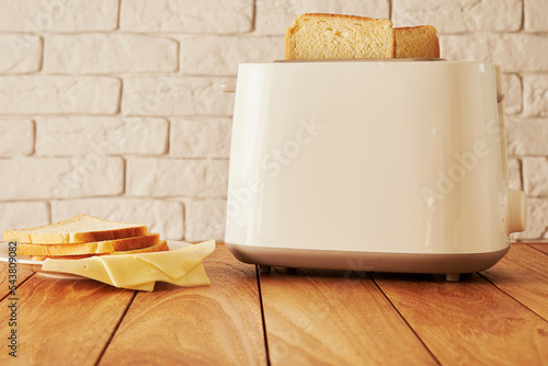 Fresh bread slices and cheese and toast for breakfast. Cooking and homeware technologies backgrounds photo