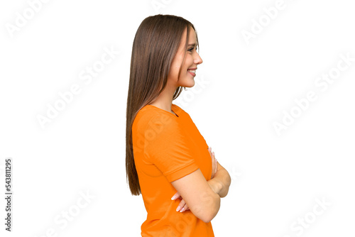 Young pretty caucasian woman over isolated background in lateral position