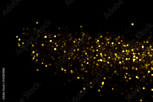 a stripe of yellow defocused lights on a black background