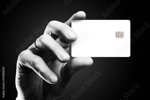 Man's hand holding credit card. photo