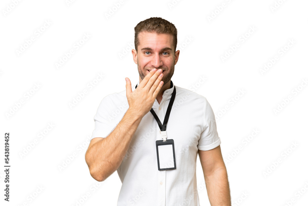 Young caucasian man with ID card isolated on green chroma background happy and smiling covering mouth with hand Young caucasian man with ID card isolated on green chroma background happy and smiling covering mouth with hand