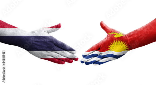 Handshake between Kiribati and Thailand flags painted on hands, isolated transparent image.