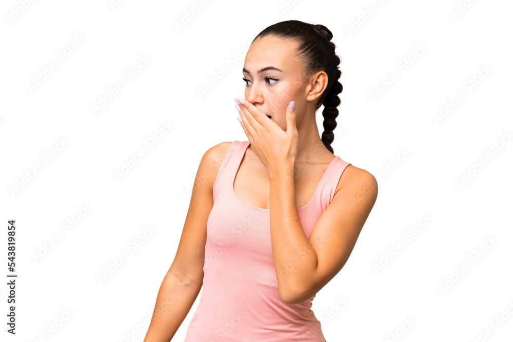 Young Arab woman over isolated background doing surprise gesture while looking to the side Young Arab woman over isolated background doing surprise gesture while looking to the side