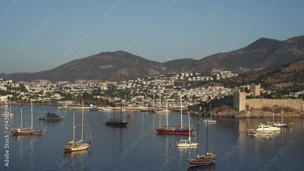 Aerial view of Bodrum bay, Turkey. Seashore, sailboats, boats, mountains and fort in Bodrum. Aerial view of Bodrum bay, Turkey. Seashore, sailboats, boats, mountains and fort in Bodrum.