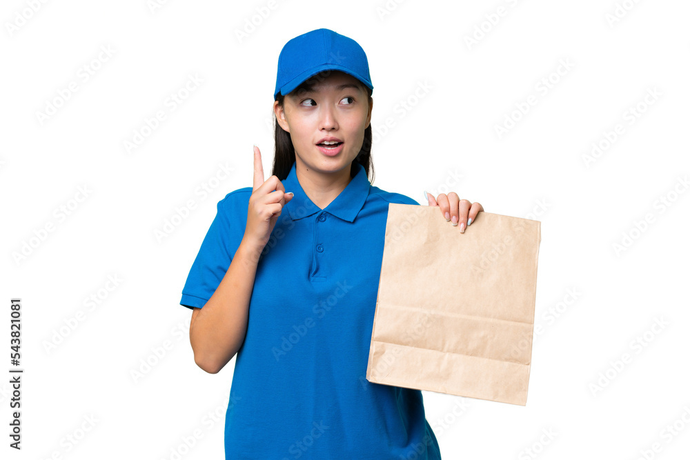 Young Asian woman taking a bag of takeaway food over isolated background thinking an idea pointing the finger up Young Asian woman taking a bag of takeaway food over isolated background thinking an idea pointing the finger up