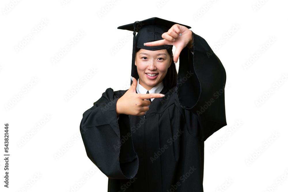 Young university graduate Asian woman over isolated background focusing face. Framing symbol Young university graduate Asian woman over isolated background focusing face. Framing symbol
