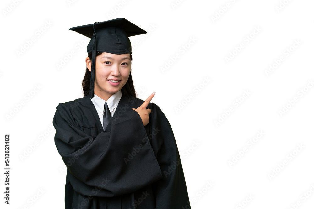 Young university graduate Asian woman over isolated background pointing to the side to present a product Young university graduate Asian woman over isolated background pointing to the side to present a product