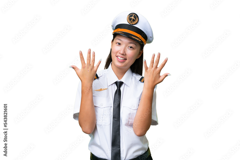Airplane pilot Asian woman over isolated background counting ten with fingers