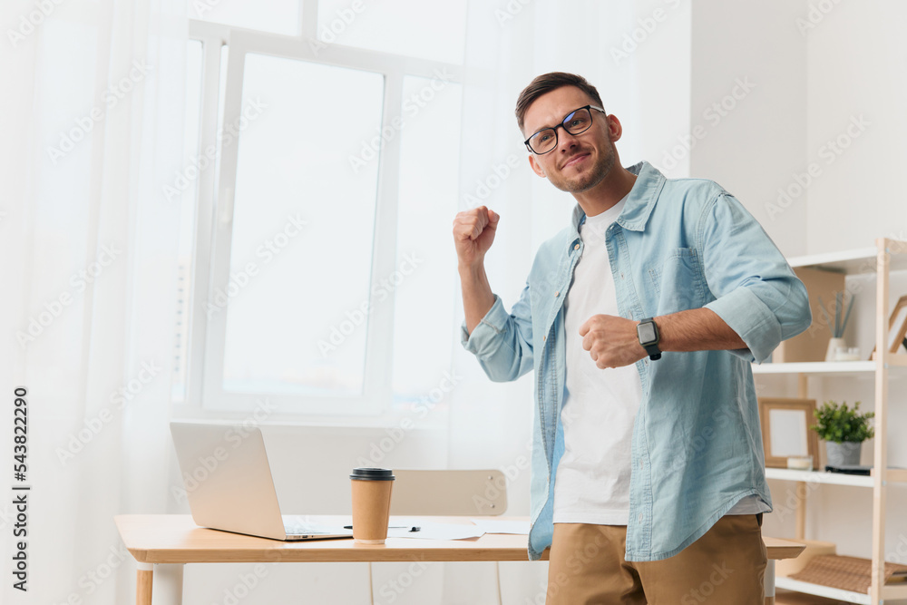 Overjoyed happy handsome stylish young businessman in eyewear tells startup idea to subordinates staying near office table. Copy space for ad. Remote Job, Technology And Career Profession Concept
