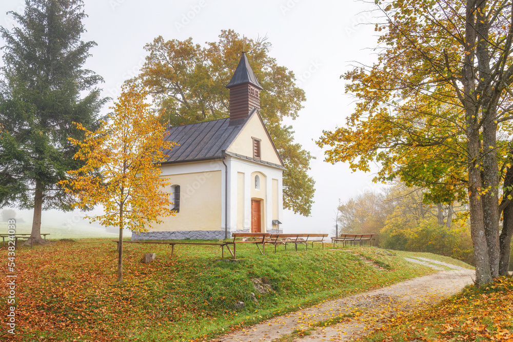 Autumn foggy country with a chapel under the Podskalsky Rohac hill in Strazov Mountains Protected Landscape Area, Slovakia, Europe. Autumn foggy country with a chapel under the Podskalsky Rohac hill in Strazov Mountains Protected Landscape Area, Slovakia, Europe.