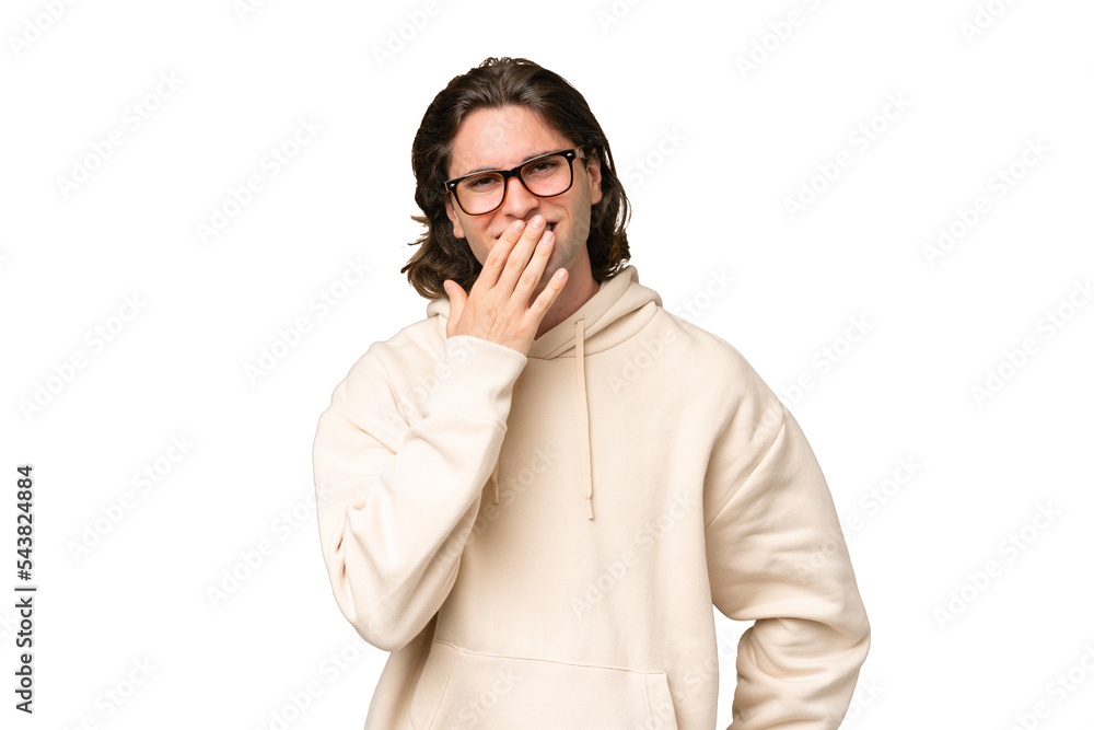 Young caucasian man isolated on green chroma background happy and smiling covering mouth with hand Young caucasian man isolated on green chroma background happy and smiling covering mouth with hand