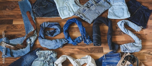 The word jeans made from different denim clothes. Fashion style background. Denim daze. Shopping concept. Banner designe.