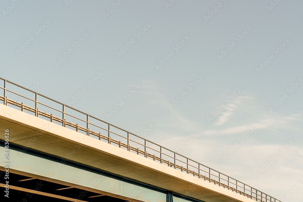 low angle view of a bridge under the blue sky at dawn