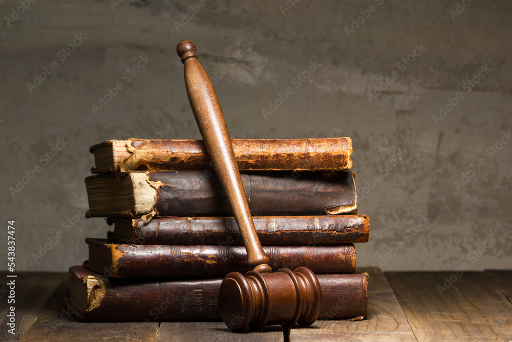 Law and justice concept. Mallet gavel of the judge, scales of justice, books. Copy space for text