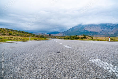 Passing road with markings in Albania on a summer day © Olga Koronyevska