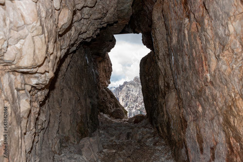 View through an old embrasure in an alpine fortress of the World War I, marking the former Austro-Italian frontier in the Dolomite mountains, South Tirol