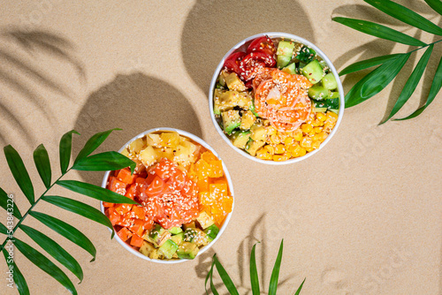 Hawaiian traditional food poke bowl on sand