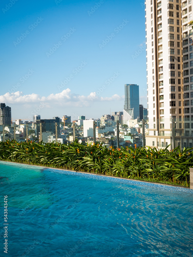 Obraz premium View of the city Ho Chi Minh with a pool in the foreground