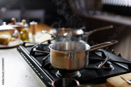 Pot boiling on stove in kitchen