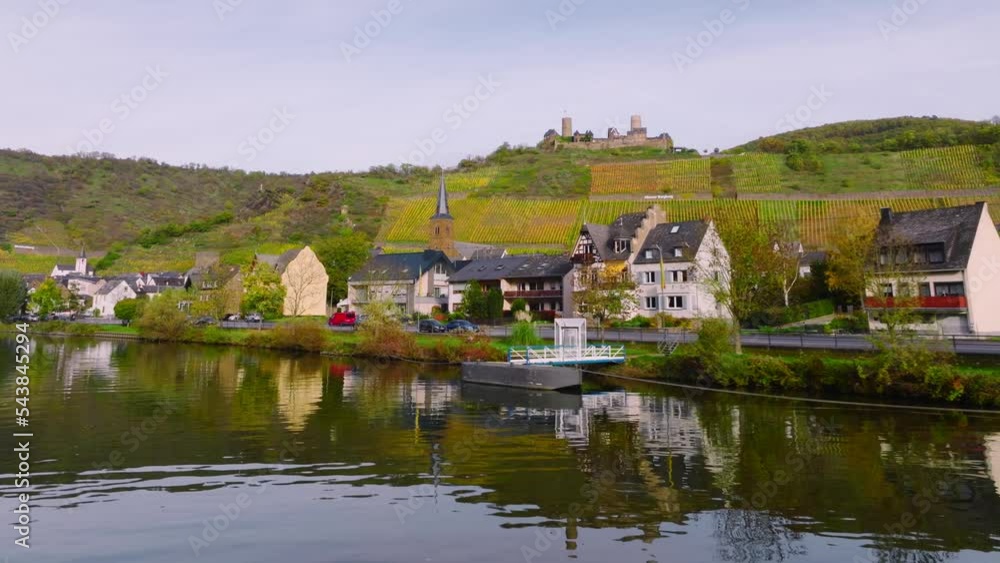 Burg Thurant at the Mosel vineyards nestled in the hills. Aerial Drone Shot of Thurant Castle the Moselle River, Germany Burg Thurant at the Mosel vineyards nestled in the hills. Aerial Drone Shot of Thurant Castle the Moselle River, Germany