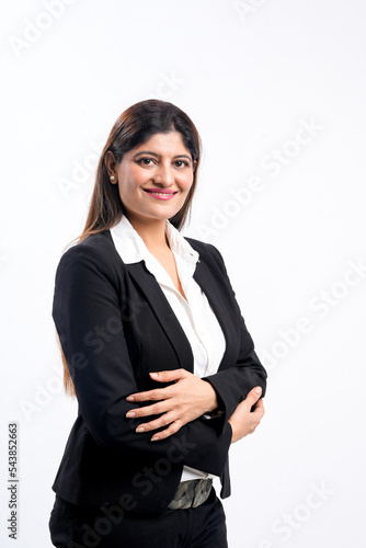 Young indian businesswoman or employee standing on white background.