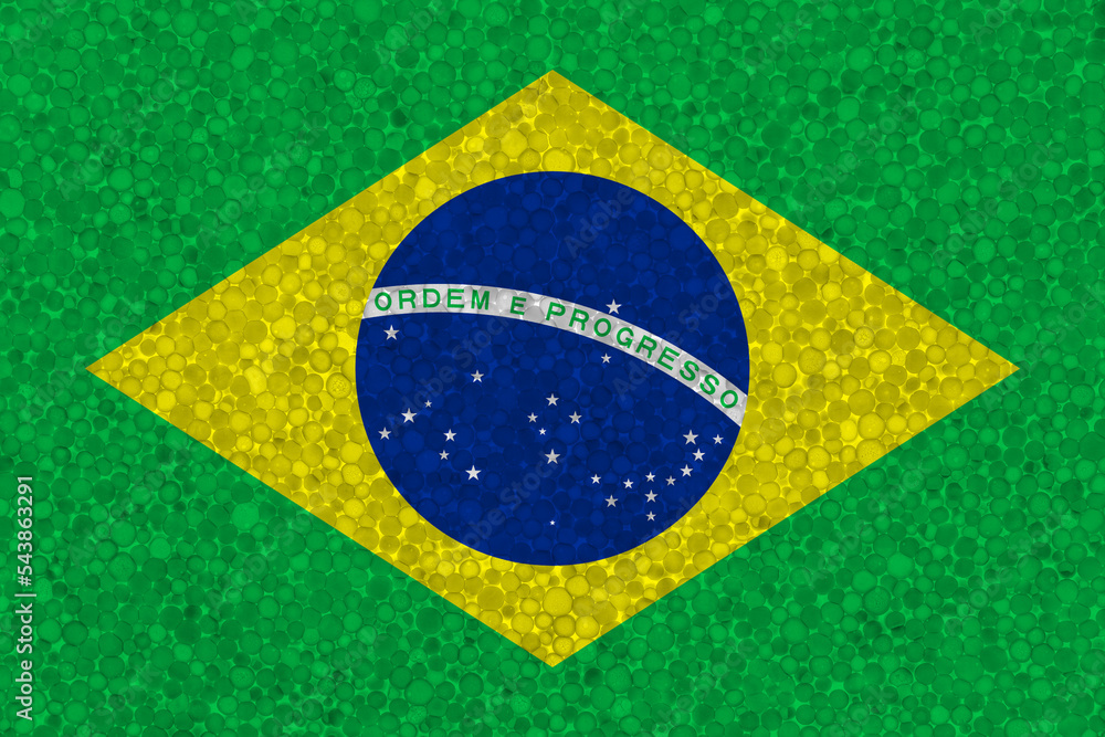 Fototapeta premium Flag of Brazil on styrofoam texture. national flag painted on the surface of plastic foam