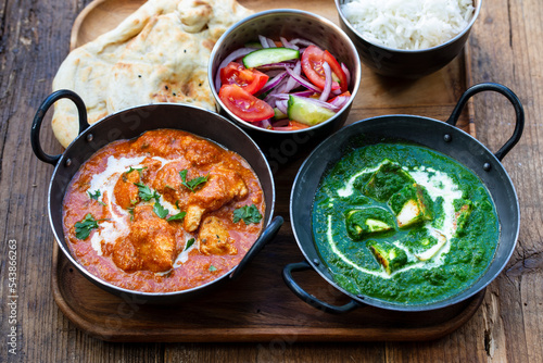 Butter chicken, saag paneer, toamto salad and naan bread