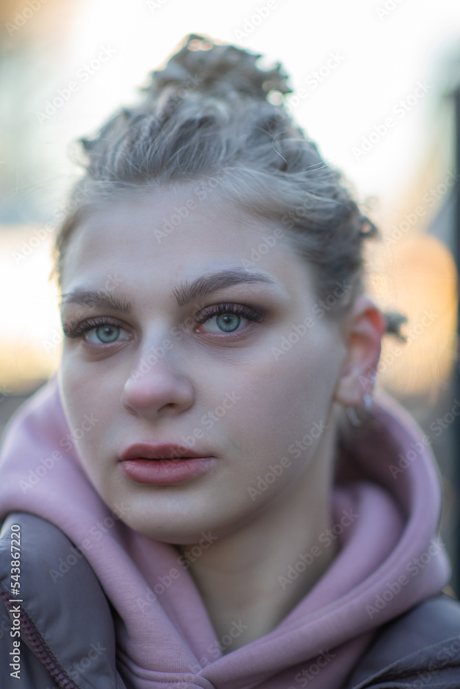 Portrait of a young beautiful blonde girl with a beautiful hairstyle. Portrait of a young beautiful blonde girl with a beautiful hairstyle.