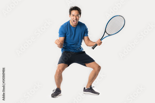 Happy male tennis player rejoicing at success. © Naypong Studio