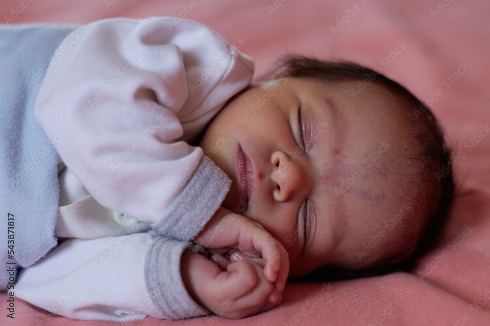 close up shot of a sleeping cute newborn baby close up shot of a sleeping cute newborn baby