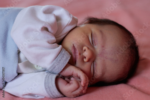close up shot of a sleeping cute newborn baby 