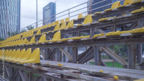 Destroyed stadium stands. Broken fan chairs.