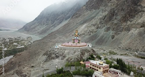 Lord Buddha statue against blue sky, Diskit Monastery in Nubra Valley, Leh, Ladakh photo