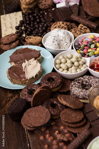 Chocolate cream on a bread and heap of a sweets © sanjagrujic