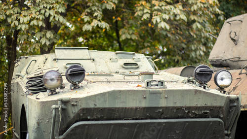 Soviet-made armored vehicles on the street. Soviet and Russian armored personnel carrier or infantry fighting vehicle.