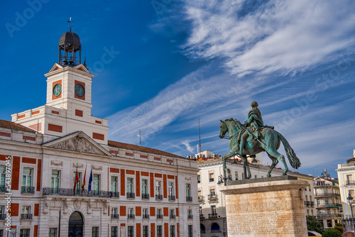 Puerta del Sol buildings and statue on a sunny day, Madrid photo