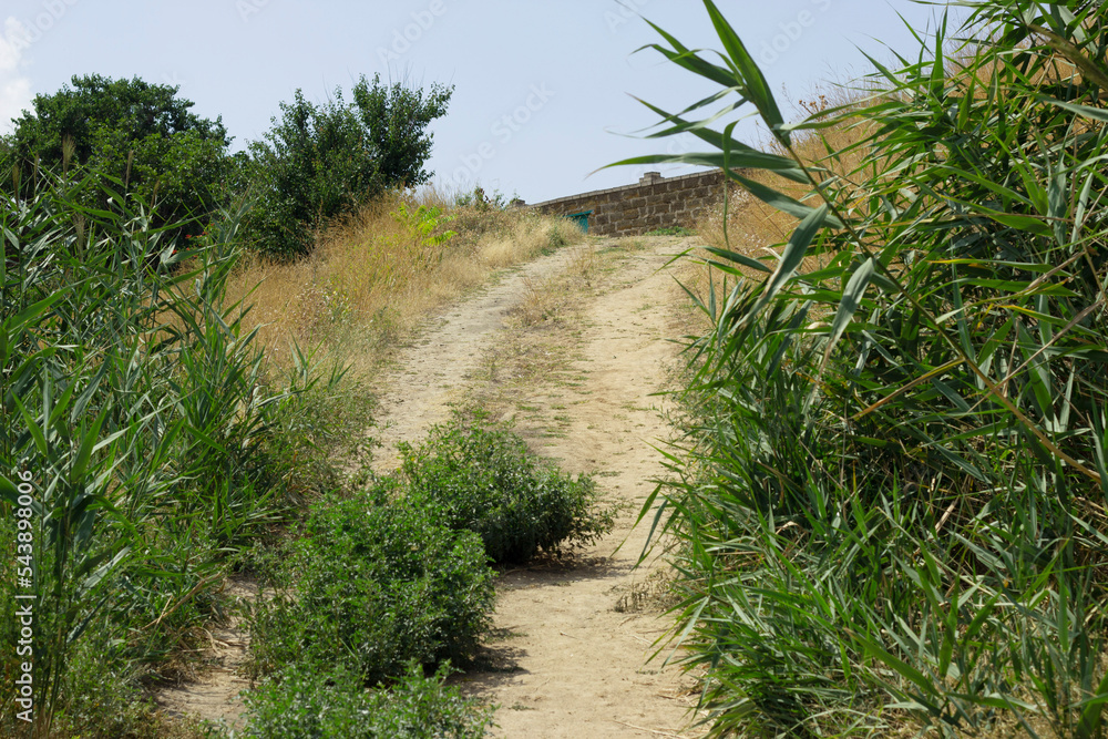 A country road in the countryside rises steeply A country road in the countryside rises steeply