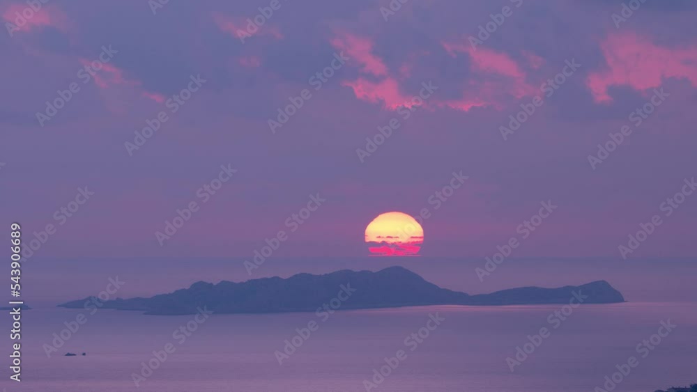 Scenic time lapse of sunset over sea. Sun goes down into sea Scenic time lapse of sunset over sea. Sun goes down into sea