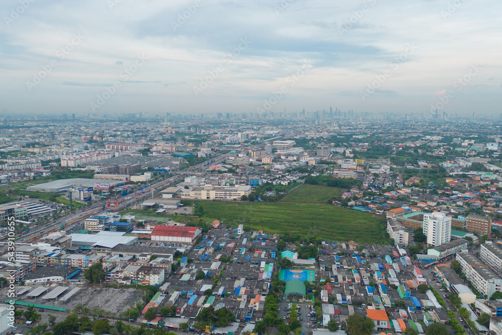 Aerial view of residential neighborhood roofs. Urban housing development from above. Top view. Real estate in Bangkok City, Thailand. Property real estate.