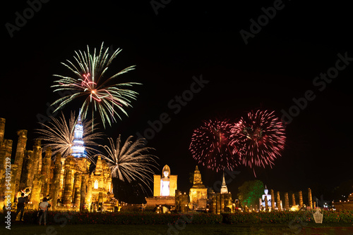 Firework at event of Loi Krathong festival showing in Sukhothai historical park, Thailand.