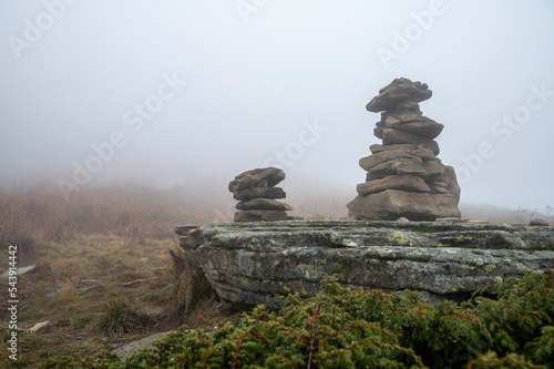 stone sculpture of stones on the mountain  fog and mountain nature 