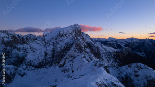 sunset in the mountains covered by snow