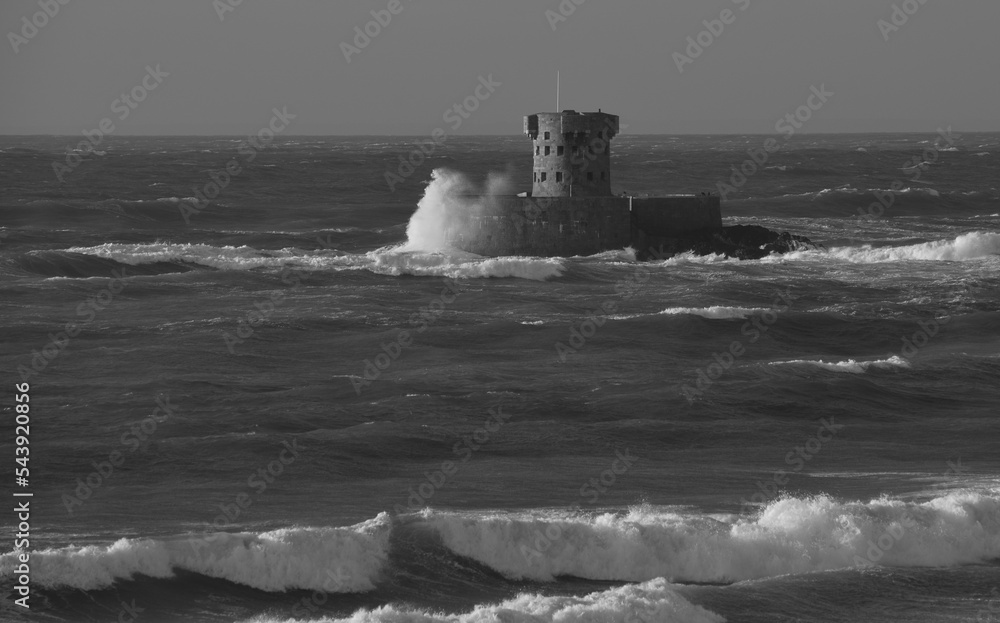 St.Ouen’s Bay, Jersey, U.K. Dramatic coastal Autumnal weather in black and white.