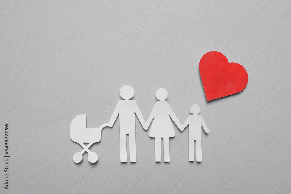 Paper family cutout and red heart on grey background, flat lay. Insurance concept Paper family cutout and red heart on grey background, flat lay. Insurance concept