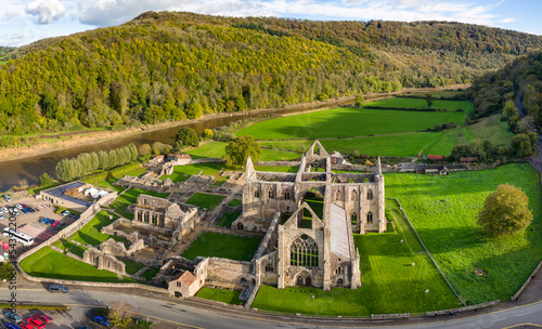 Aerial view of an ancient ruined monastery in Wales (Tintern Abbey. 12th century AD) photo