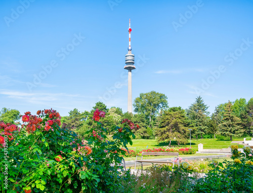 View with The Donauturm(Danube Tower) located in Donau Park. Iconic tower with observation terraces. Famous touristic attraction photo